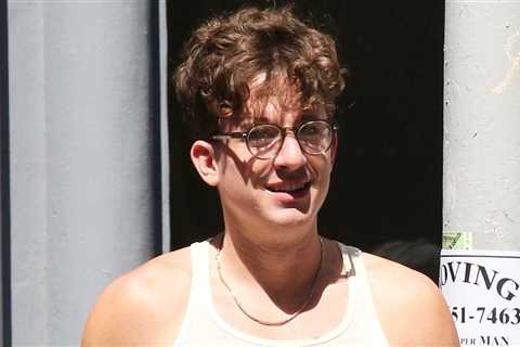 Charlie Puth wears a tight tank top in NYC during the day