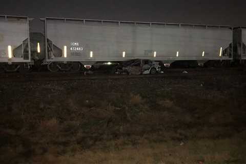 Police investigating fiery crash with train in SE Houston after man was shot