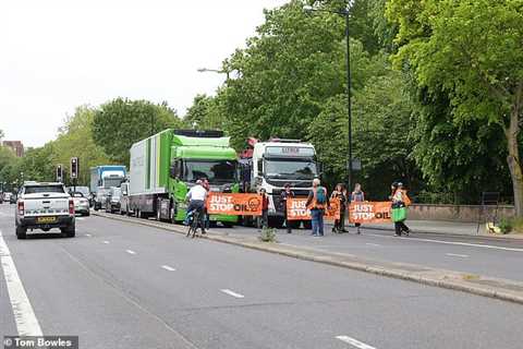 Just Stop Oil slow march in front of HGVs in Finchley, north-west London