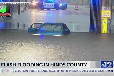 Vehicle submerged due to flooding in Jackson